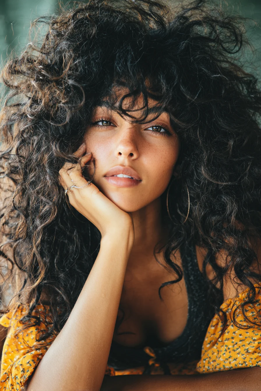Voluminous Long Natural Curls with Wispy Fringe